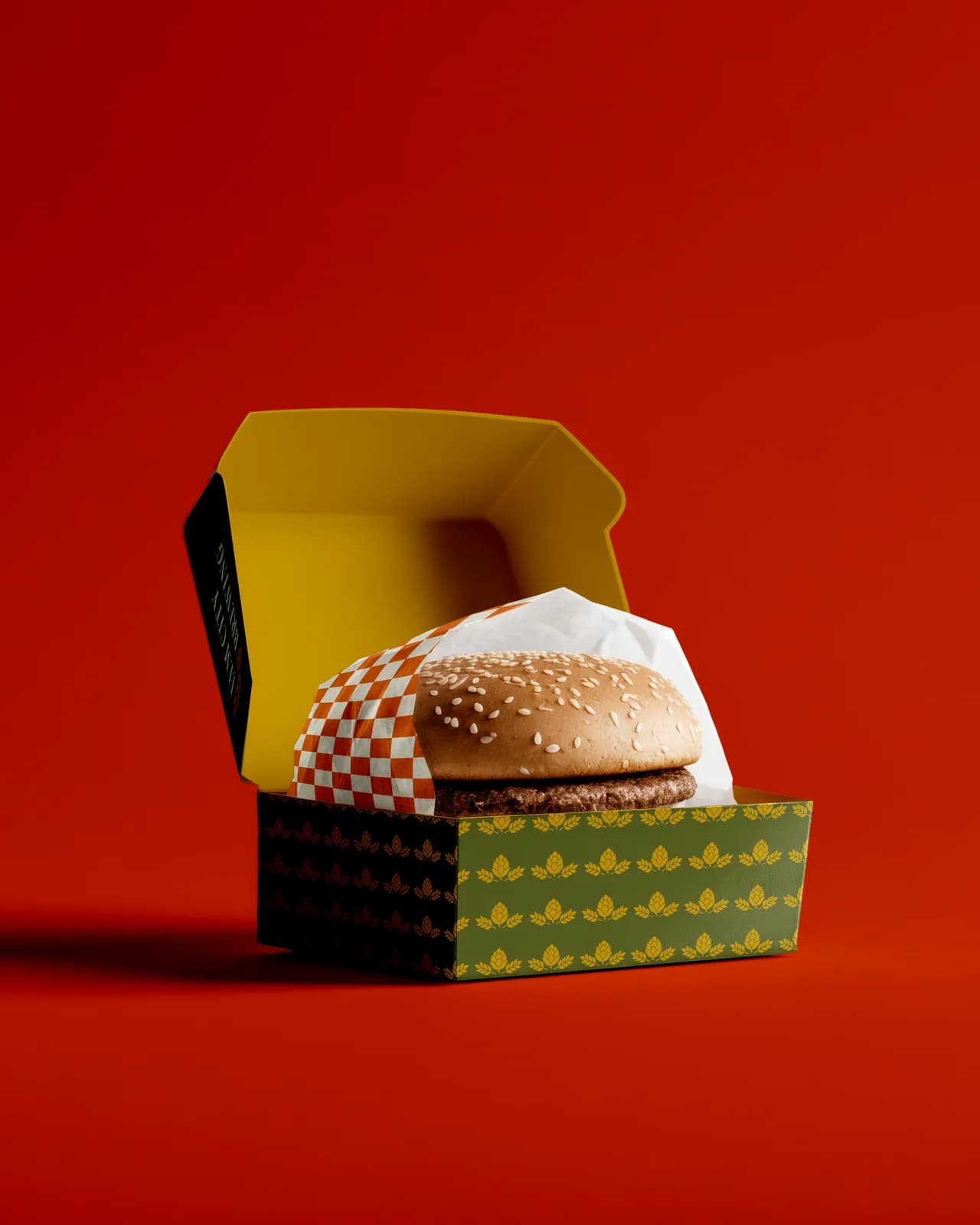 Elm City Brewing branded burger box and fry carton on red