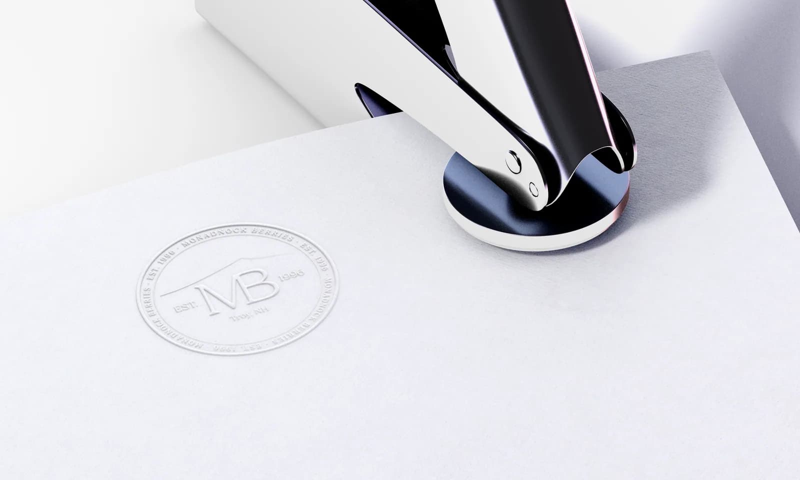 Monadnock Berries logo blind embossed into paper