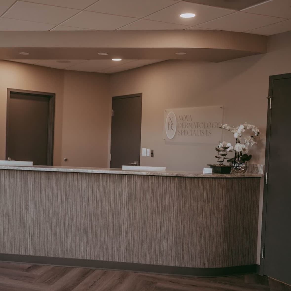 Nova Dermatology reception area with branded signage — environmental design by Black Rabbit Creative
