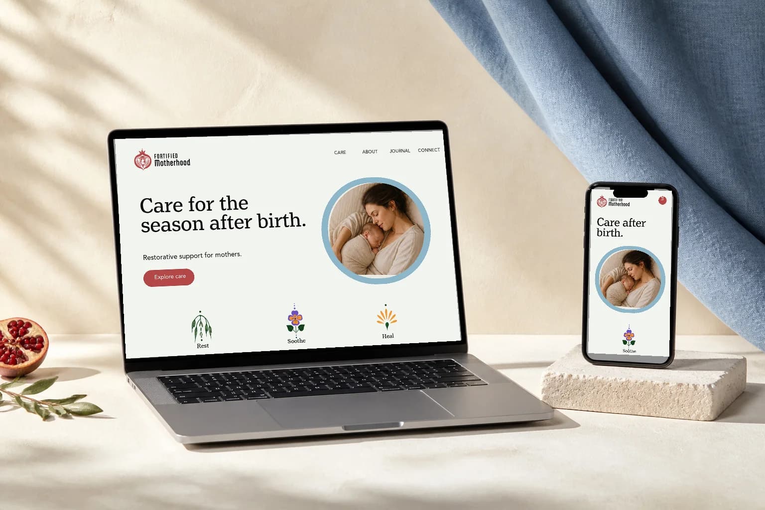 Fortified Motherhood website design shown on a laptop and phone, with the pomegranate logo and botanical icons